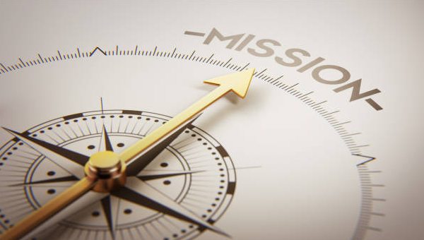 Compass needle pointing to the word Mission